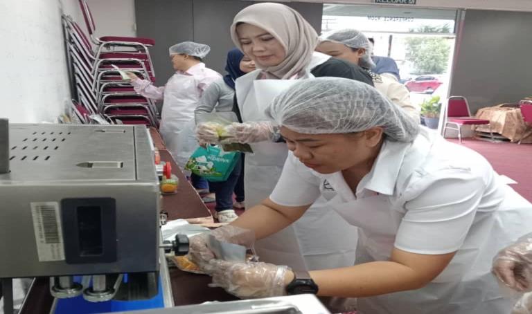 Participant operating a food sealing machine during training